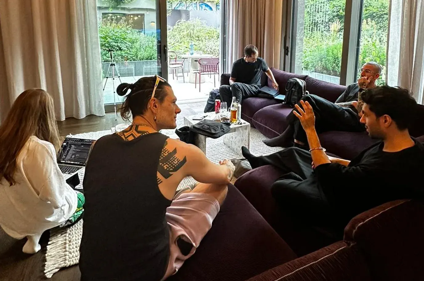 Teammates relaxing on lounge sofas during an offsite