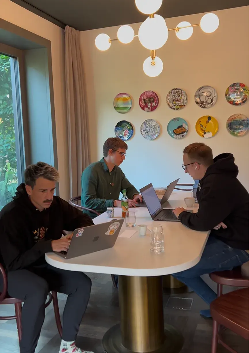 Teammates working together around a table